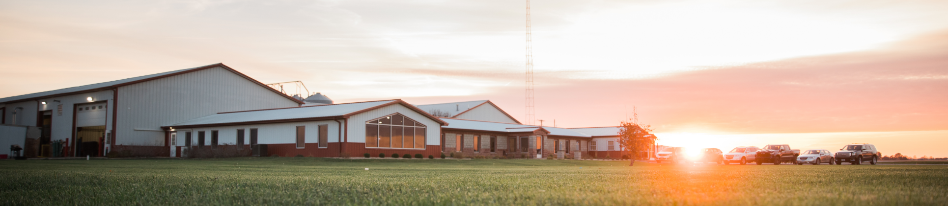 Company building with the sun setting.